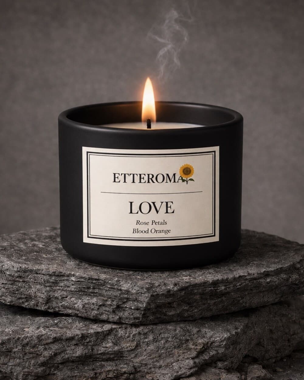 The Love candle on stacked slate